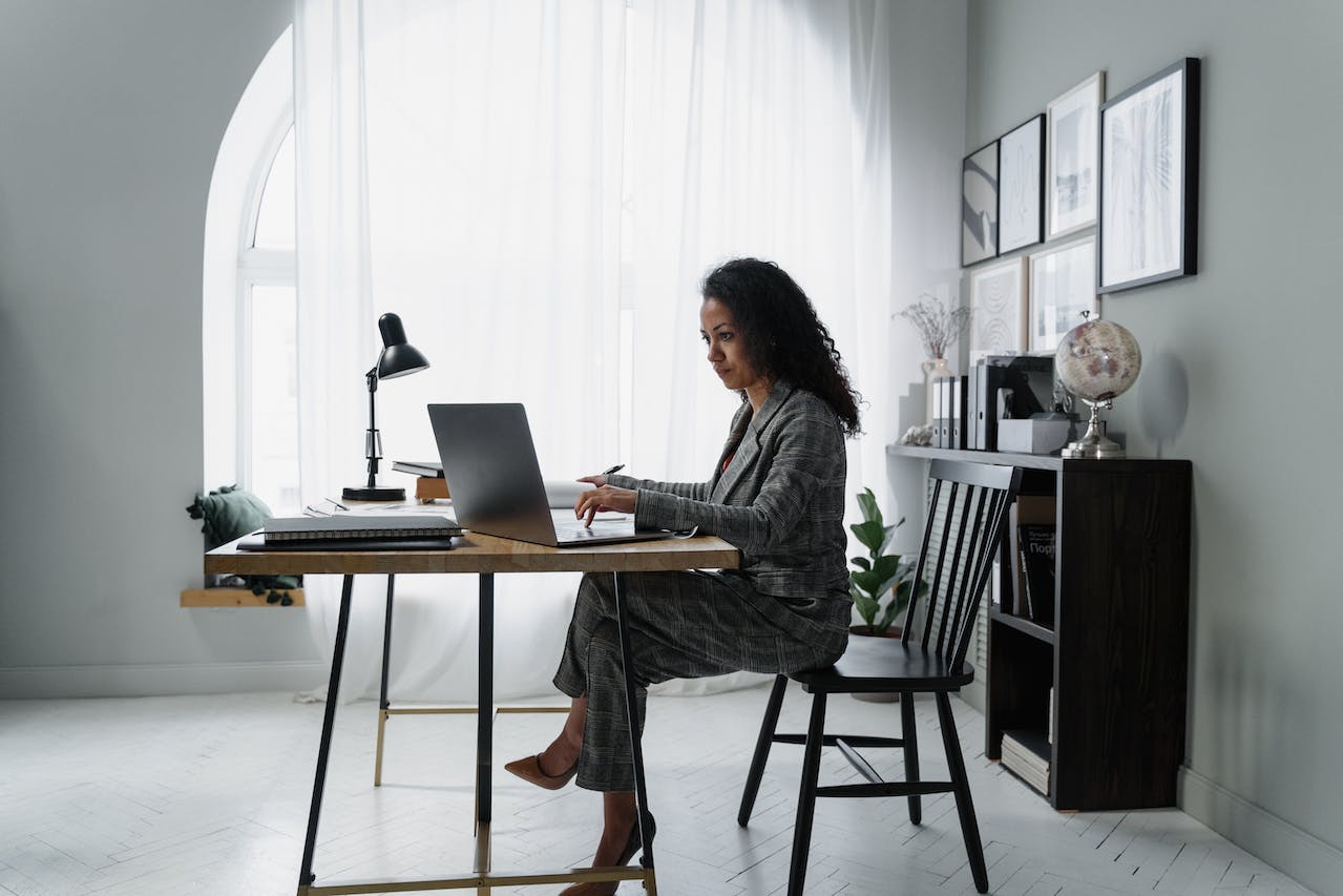 Woman working on payroll at desk