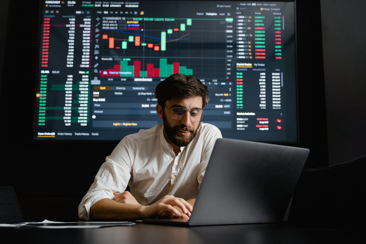 Man in front of complex finance chart